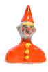 Small ceramic gnome figurine with a red hat and outfit on a white background